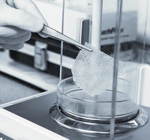 Brightwake Ltd employee holding a sample